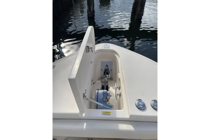  Yacht Photos Pics 2023 Grady-White Canyon 306 boat anchor compartment, open lid, dockside view.
