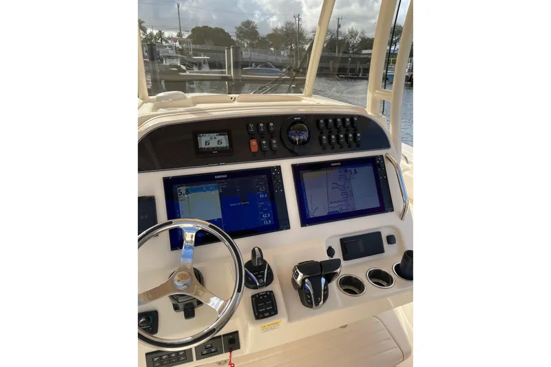  Yacht Photos Pics 2023 Grady-White Canyon 306 helm with advanced navigation displays and controls.