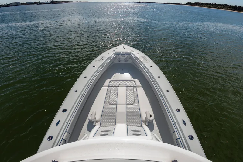 Fin Print Yacht Photos Pics 2023 Contender 44FA 44ST boat on calm water, showcasing sleek design and spacious deck.