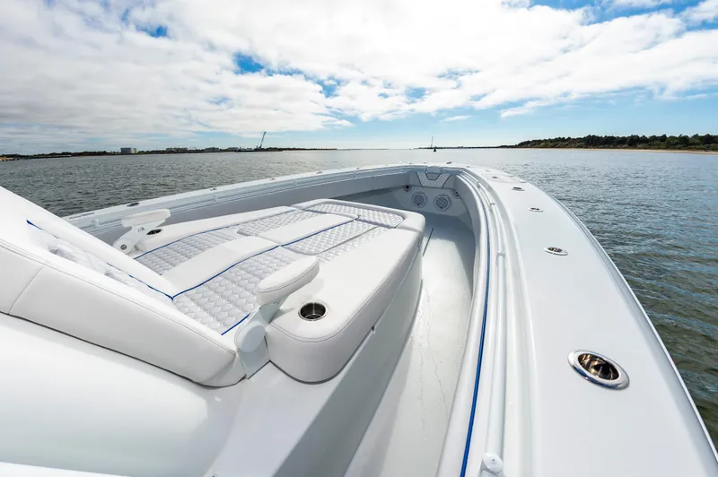 Fin Print Yacht Photos Pics 2023 Contender 44FA 44ST boat with luxurious seating on calm waters.