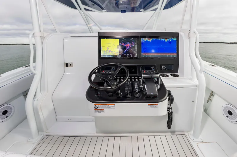 Fin Print Yacht Photos Pics 2023 Contender 44FA boat helm with dual navigation screens and controls.