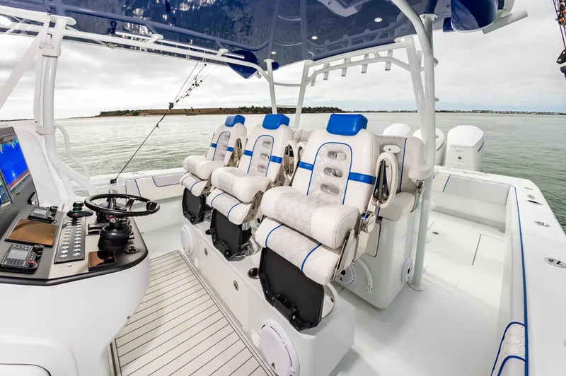 Fin Print Yacht Photos Pics 2023 Contender 44FA 44ST boat interior with luxury seating and advanced control panel.