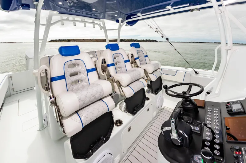 Fin Print Yacht Photos Pics Luxurious 2023 Contender 44FA boat interior with plush seating and advanced control panel.