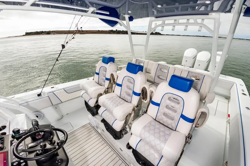Fin Print Yacht Photos Pics 2023 Contender 44FA 44ST boat interior with luxury seating and modern controls.