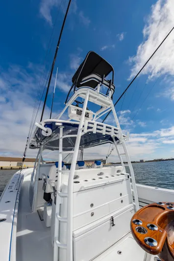 Fin Print Yacht Photos Pics 2023 Contender 44FA 44ST boat with tower and rod holders on open water.