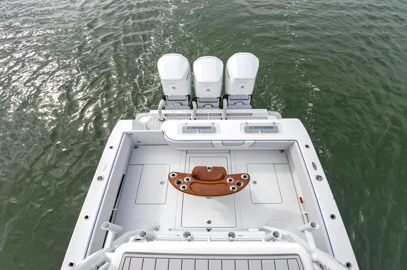 Fin Print Yacht Photos Pics 2023 Contender 44FA 44ST boat with triple engines on open water.