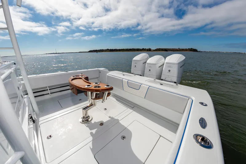 Fin Print Yacht Photos Pics 2023 Contender 44FA boat with triple Mercury engines on open water.