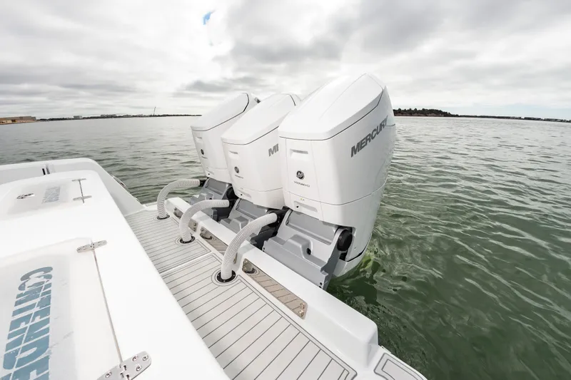 Fin Print Yacht Photos Pics 2023 Contender 44FA boat with triple Mercury outboard engines on water.