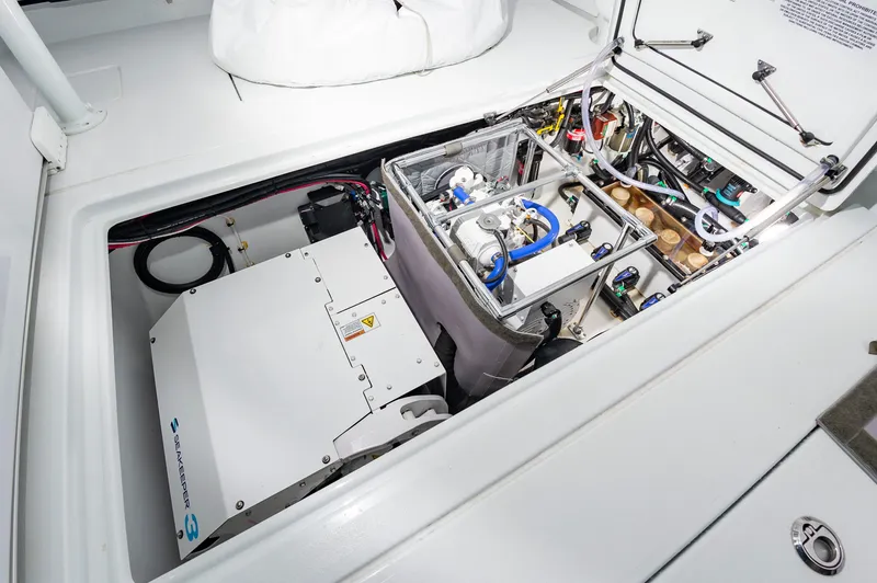 Fin Print Yacht Photos Pics 2023 Contender 44FA boat engine compartment with Seakeeper 3 stabilizer and mechanical components.