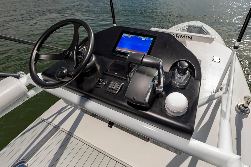 Fin Print Yacht Photos Pics 2023 Contender 44FA boat helm with Garmin navigation system on water.