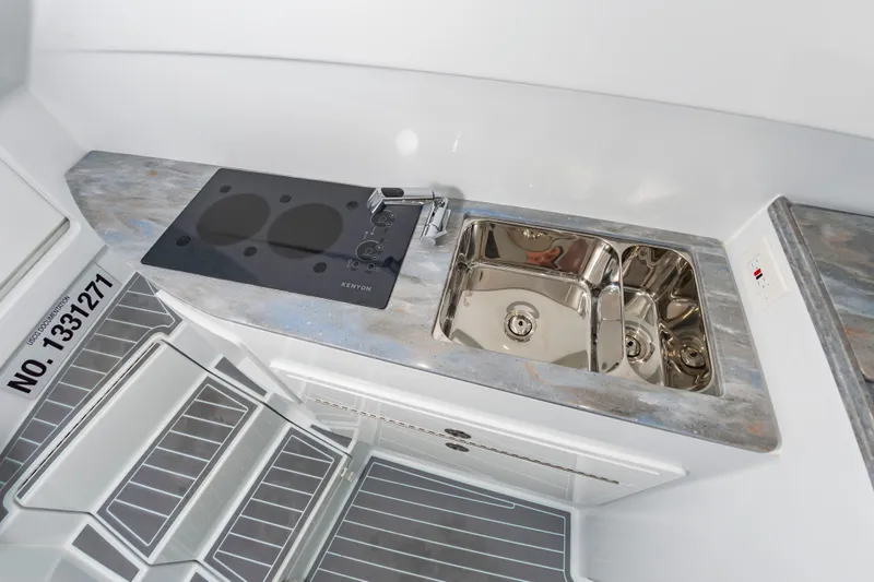 Fin Print Yacht Photos Pics 2023 Contender 44FA boat kitchen with sink and stovetop.