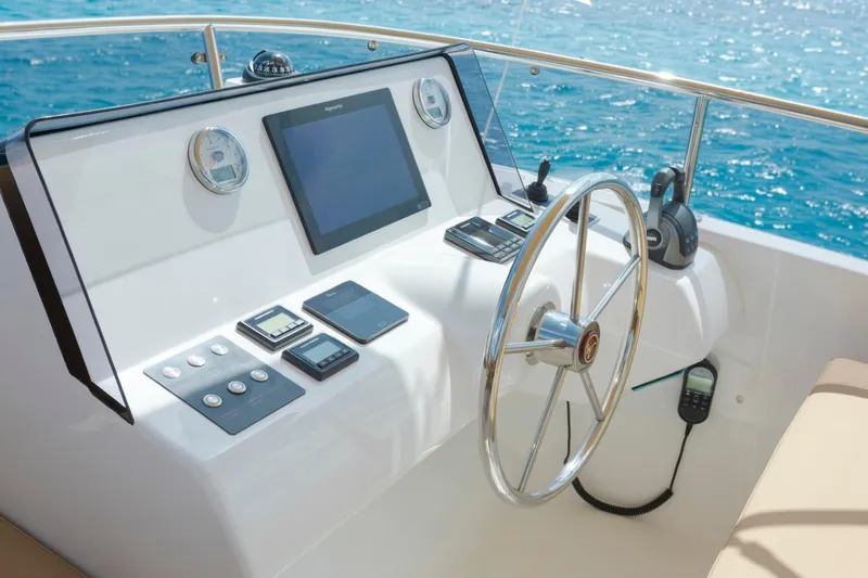  Yacht Photos Pics Helm of 2026 Sasga Yachts 55 with modern navigation equipment and ocean view.
