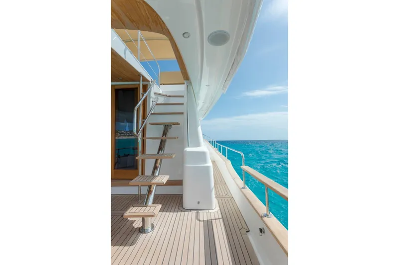  Yacht Photos Pics Luxury Sasga Yachts 55 (2026) deck with ocean view and elegant staircase.