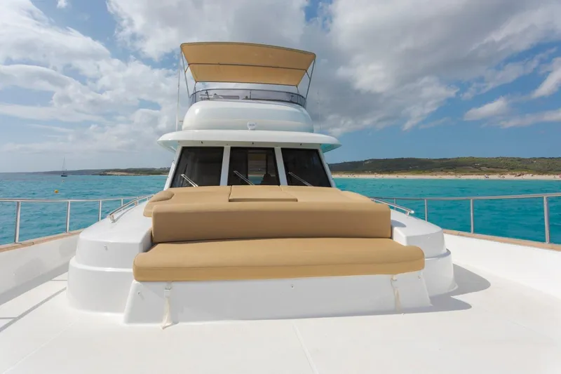  Yacht Photos Pics 2026 Sasga Yachts 55 on turquoise waters, featuring spacious deck and luxurious seating.