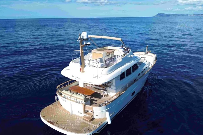  Yacht Photos Pics 2026 Sasga Yachts 55 cruising on open sea under clear blue sky.