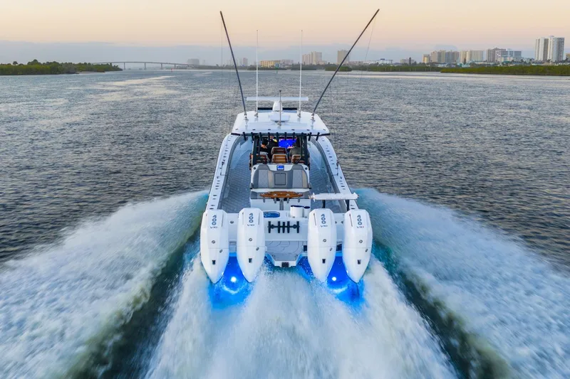  Yacht Photos Pics 2025 Freeman 43 boat cruising with powerful engines and blue lights on open water.