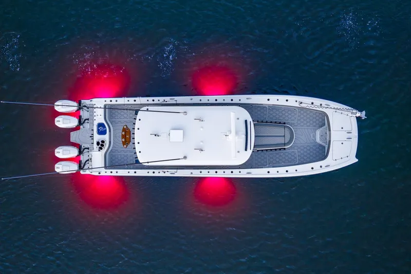  Yacht Photos Pics Aerial view of 2025 Freeman 43 boat with glowing red underwater lights.
