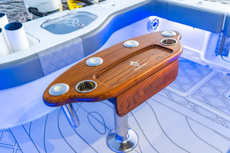  Yacht Photos Pics Luxurious Freeman 43 boat interior with elegant wooden table, 2025 model.