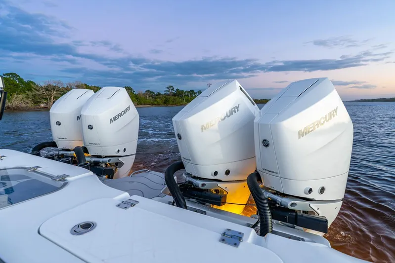  Yacht Photos Pics 2025 Freeman 43 boat with four Mercury Verado outboard engines on a calm water backdrop.