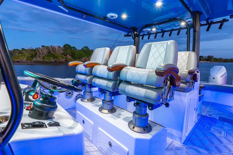  Yacht Photos Pics Luxurious interior of 2025 Freeman 43 boat with plush seating and modern controls.