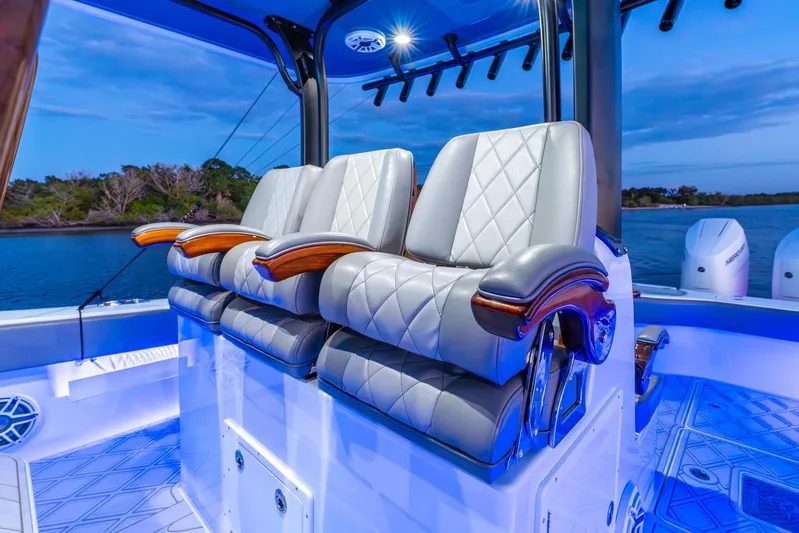  Yacht Photos Pics Luxurious seating on a 2025 Freeman 43 boat, featuring elegant design and ambient lighting.