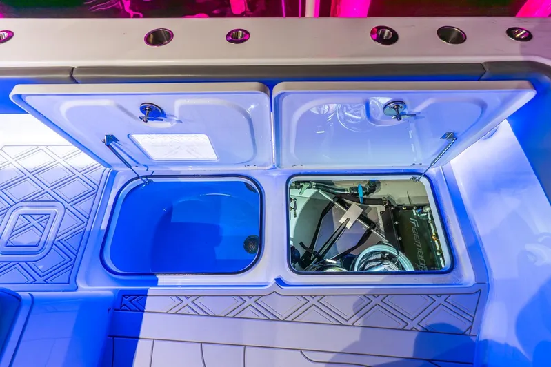  Yacht Photos Pics 2025 Freeman 43 boat storage compartments with blue lighting and modern design.