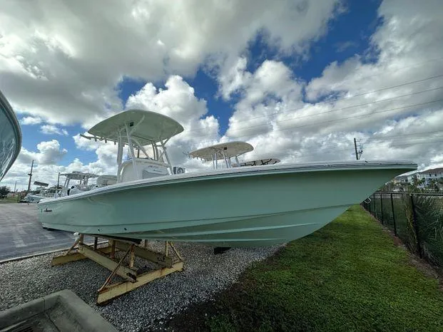 2024 Avenger 26 Avenger boat on display under cloudy sky.