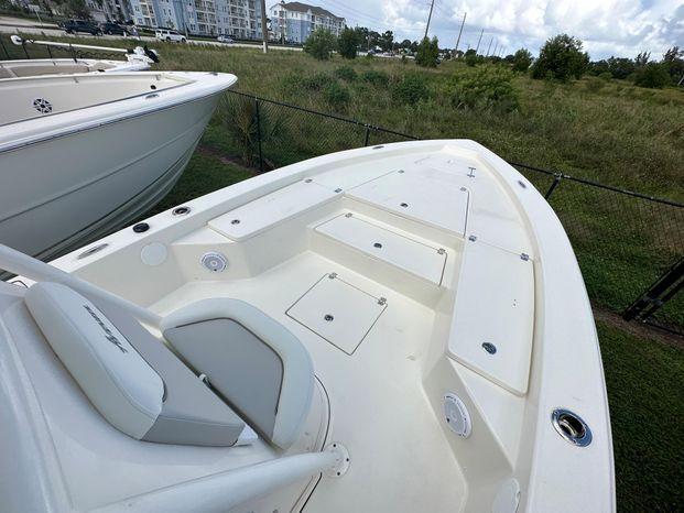 2024 Avenger 26 Avenger boat deck with seating and storage compartments.