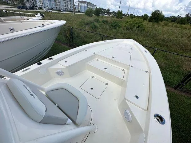 2024 Avenger 26 Avenger boat deck with seating and storage compartments.