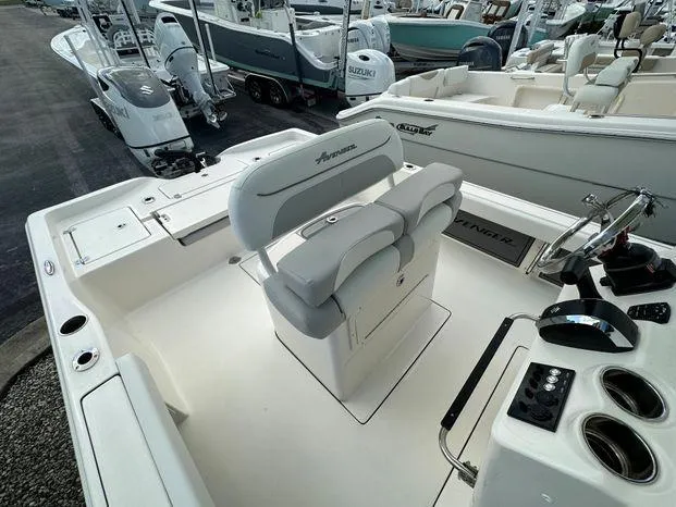 2024 Avenger 26 Avenger boat interior with dual seats and control panel.