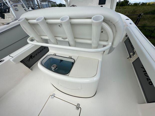 2024 Avenger 26 Avenger boat interior with rod holders and storage compartments.