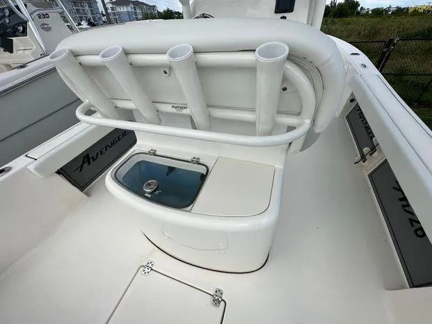 2024 Avenger 26 Avenger boat interior with rod holders and storage compartments.