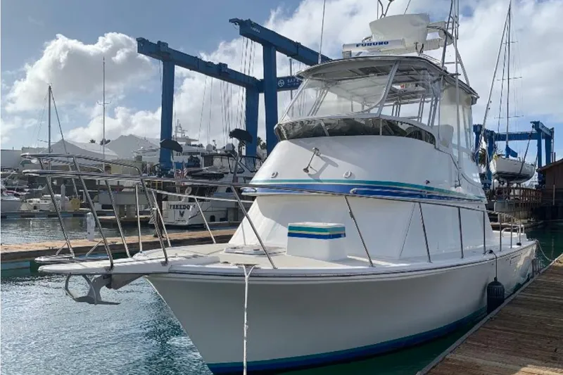 Yacht Photos Pics 1993 Radovich 34 boat docked at marina under cloudy sky.