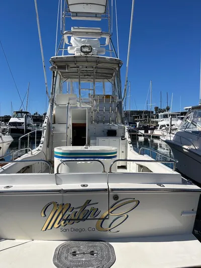  Yacht Photos Pics Radovich 34 boat, 1993 model, docked in San Diego marina under clear blue sky.