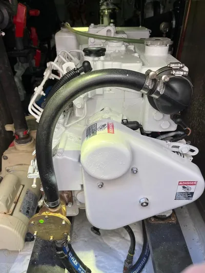  Yacht Photos Pics 1993 Radovich 34 engine with hoses and components in a mechanical setting.