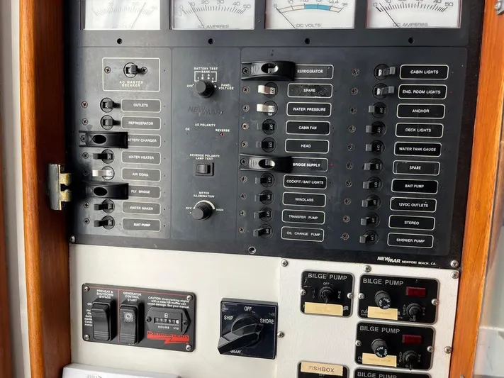  Yacht Photos Pics Control panel of a 1993 Radovich 34 boat with various switches and gauges.