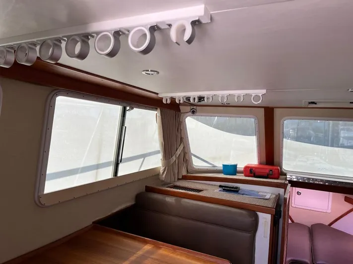  Yacht Photos Pics Interior of a 1993 Radovich 34 boat, featuring seating and windows.