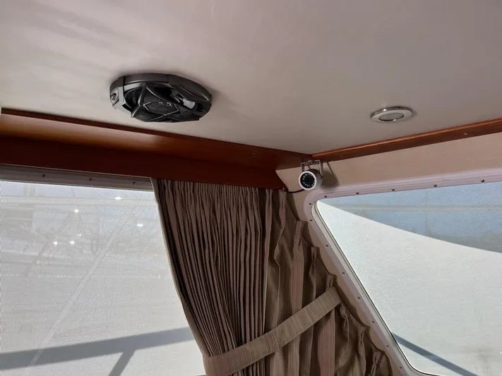  Yacht Photos Pics Interior of a 1993 Radovich 34 boat with curtains and ceiling fan.