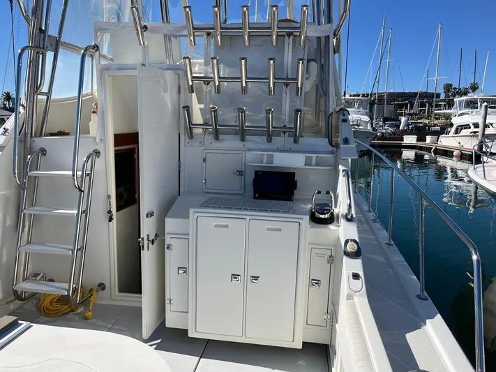  Yacht Photos Pics Radovich 34 boat interior with fishing rod holders, storage cabinets, and marina view, 1993 model.