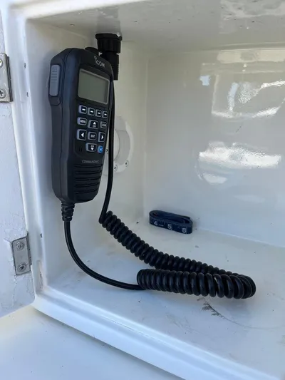  Yacht Photos Pics Marine radio in a Radovich 34, 1993 model, mounted in a white compartment.