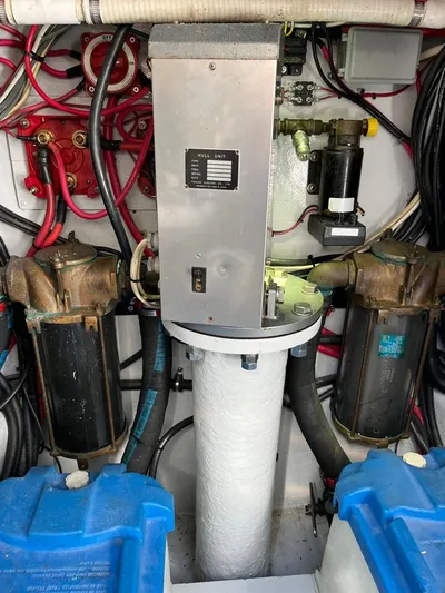  Yacht Photos Pics Engine room of a 1993 Radovich 34 boat, featuring mechanical components and wiring.