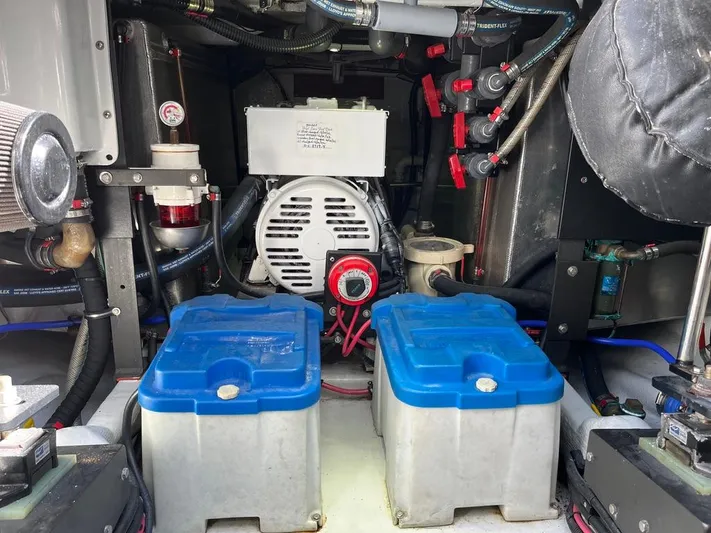  Yacht Photos Pics Engine room of a 1993 Radovich 34 boat with batteries and mechanical components.