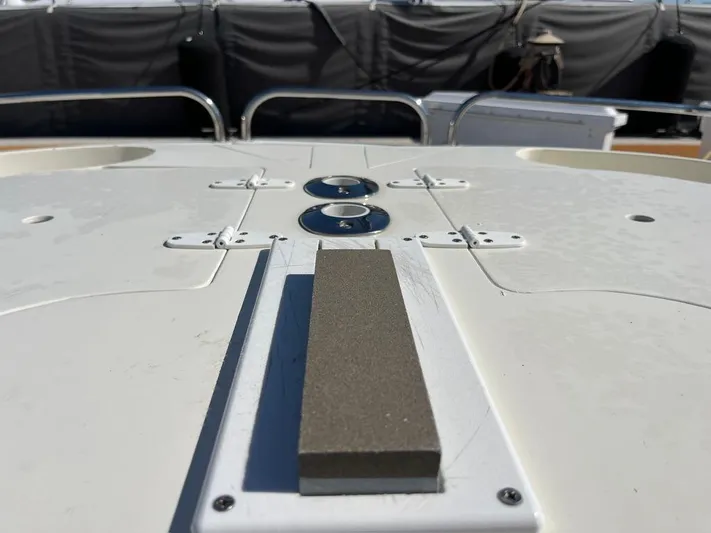  Yacht Photos Pics Deck of a 1993 Radovich 34 boat with metal fittings and textured surface.
