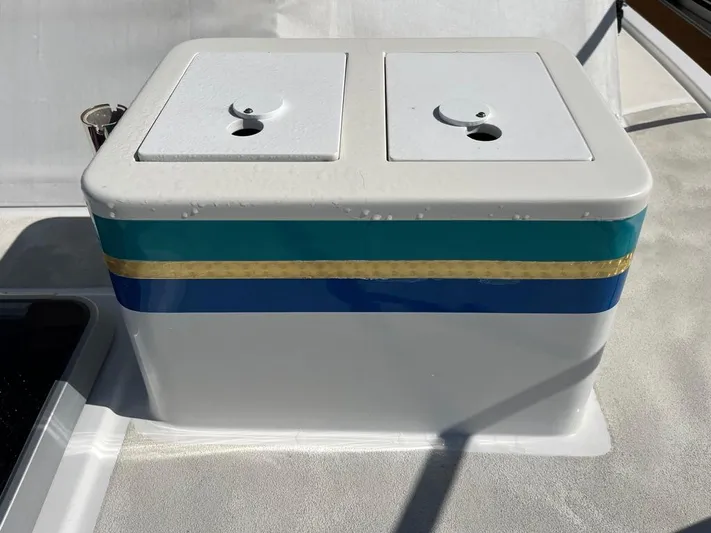  Yacht Photos Pics White storage compartment with blue and gold stripes on a 1993 Radovich 34 boat.