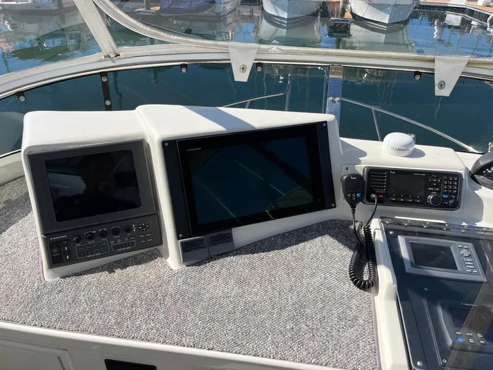  Yacht Photos Pics Control panel of a 1993 Radovich 34 boat with navigation screens and radio equipment.