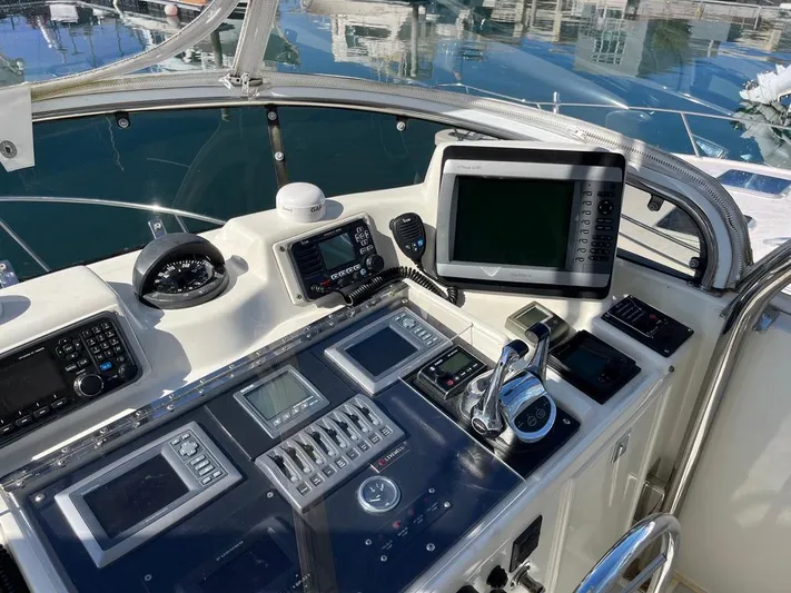  Yacht Photos Pics Control panel of a 1993 Radovich 34 boat with navigation instruments and screens.