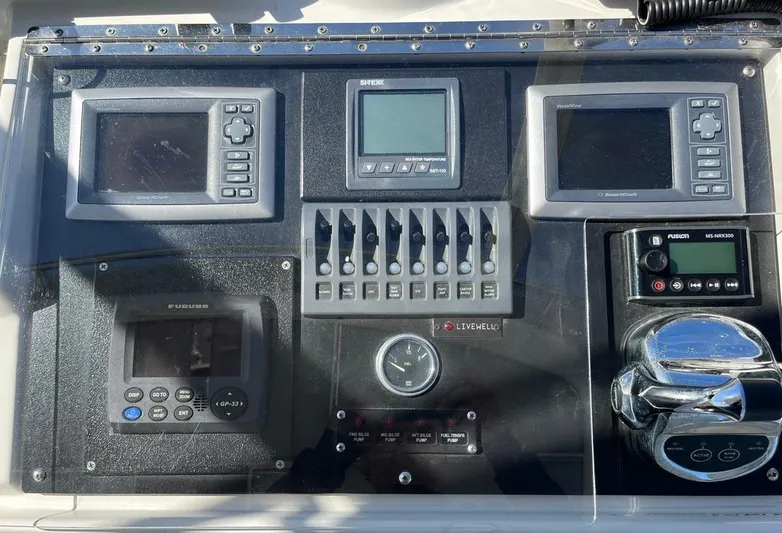  Yacht Photos Pics Control panel of a 1993 Radovich 34 boat with multiple electronic displays and switches.