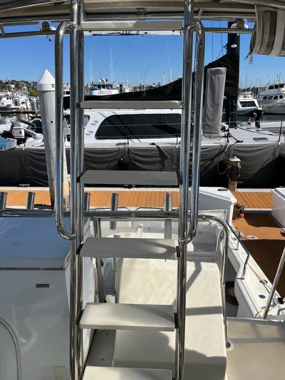 Yacht Photos Pics Stainless steel ladder on a 1993 Radovich 34 boat, docked at a marina.