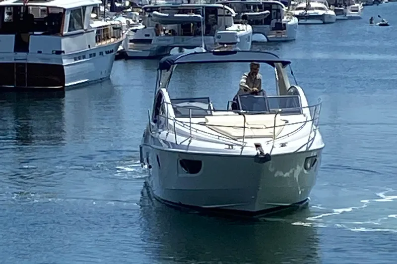  Yacht Photos Pics 2016 Beneteau GT35 yacht cruising in a busy marina.