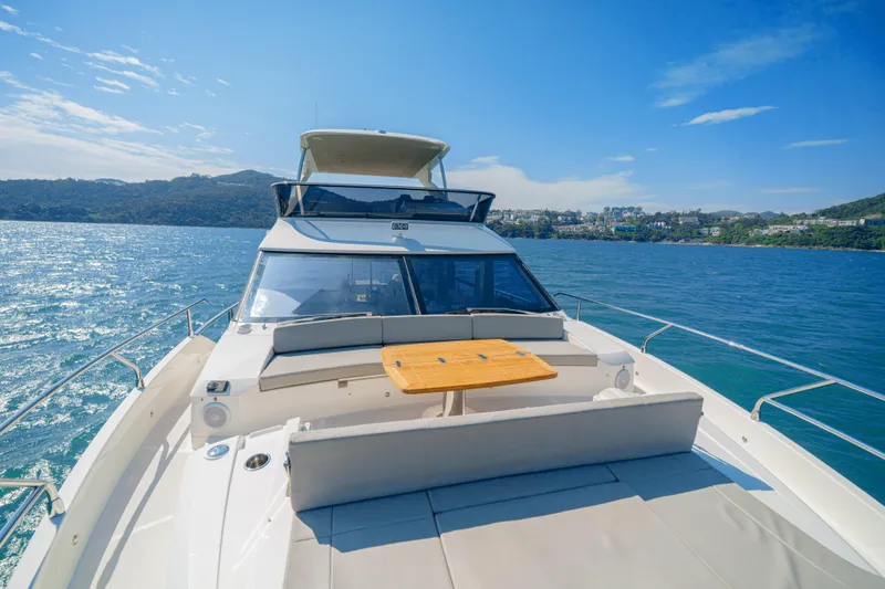  Yacht Photos Pics Luxury Absolute 56 FLY yacht cruising on a sunny day, 2022 model.